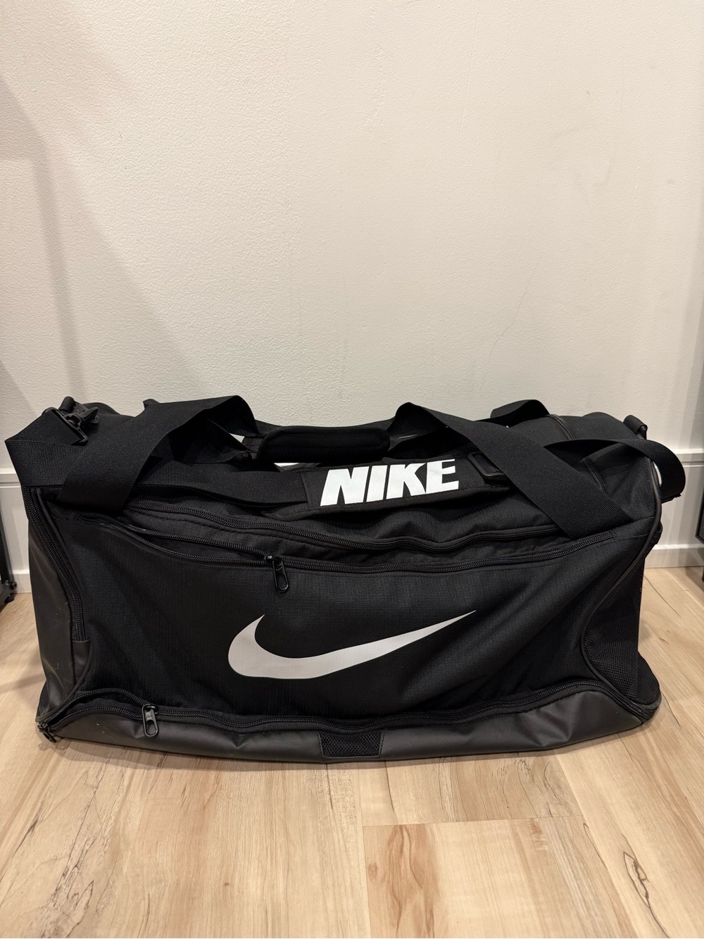 Nike Black Duffel Bag with White Swoosh and Logo